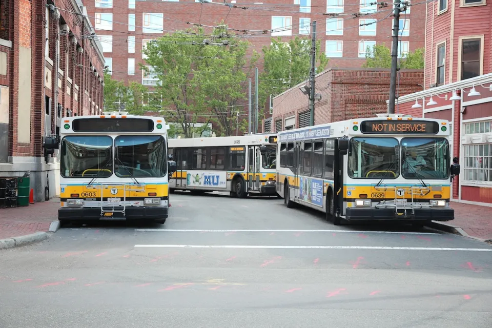 Multiple MBTA buses parked in Cambridge, Massachusetts.